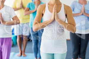 Instructor performing yoga with seniors