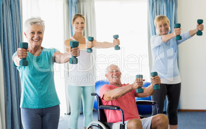 Seniors exercising with weights