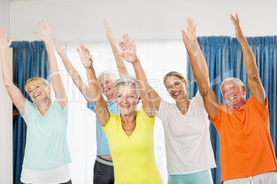 Instructor doing exercises with seniors