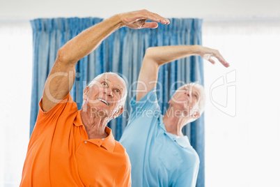 Senior men doing exercises