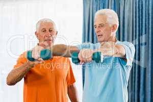 Senior exercising with weights
