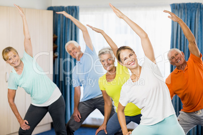 Instructor doing exercises with seniors