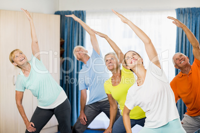 Instructor doing exercises with seniors