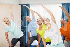 Instructor doing exercises with seniors