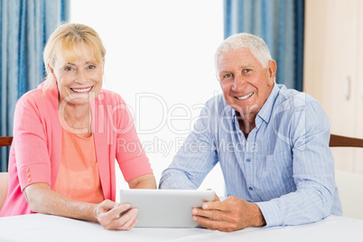Senior couple using a tablet
