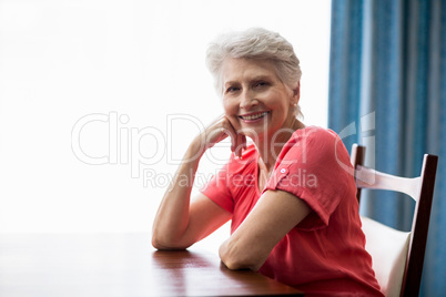 Senior woman sitting at a table