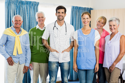 Nurse and seniors standing together