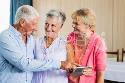 Seniors pointing on smartphone