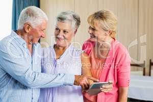 Seniors pointing on smartphone