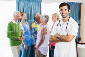 Nurse standing with arms crossed