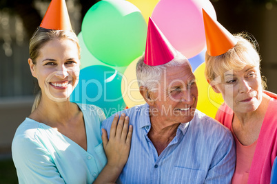 Nurse and seniors celebrating