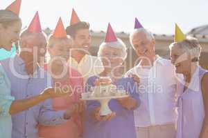 Nurse and seniors celebrating a birthday
