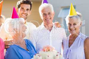 Nurse and seniors celebrating a birthday