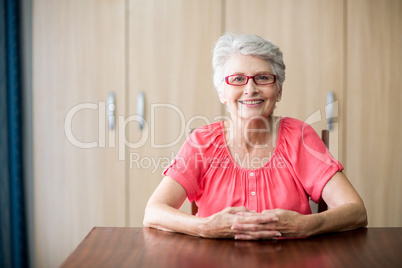 Senior woman sitting at a table