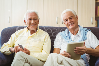 Senior men using technology