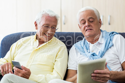 Senior men using technology