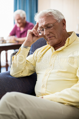 Senior sitting on a couch