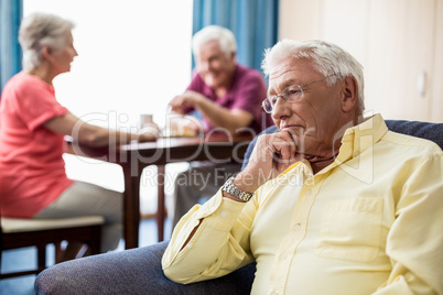 Senior sitting on a couch