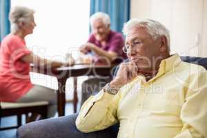 Senior sitting on a couch