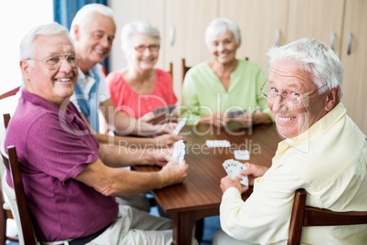 Seniors playing cards together