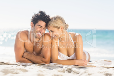 Young couple lying on beach