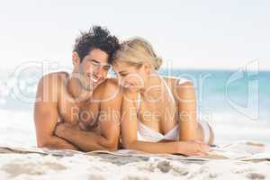 Young couple lying on beach