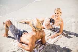 Young couple lying on beach