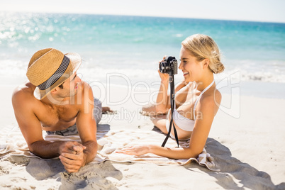 Woman taking picture of her man