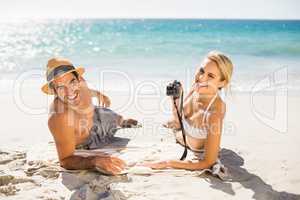 Young couple lying on beach