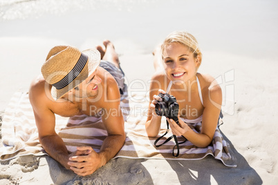 Young couple lying on beach