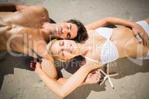 Couple lying on beach