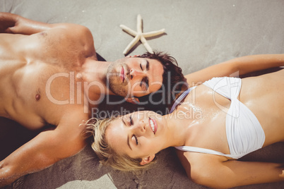 Couple lying on beach