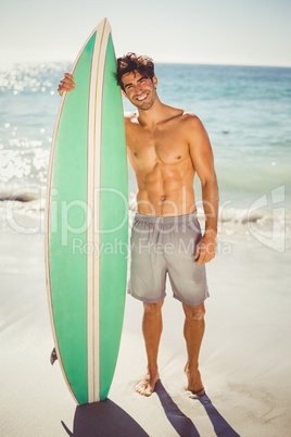 Man posing with surfboard