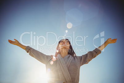 Woman standing with arms outstretched