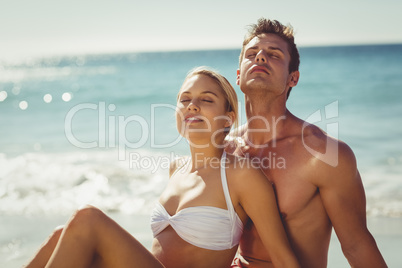 Couple relaxing on beach