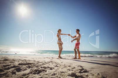 Couple dancing on beach