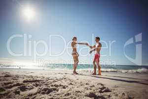 Couple dancing on beach