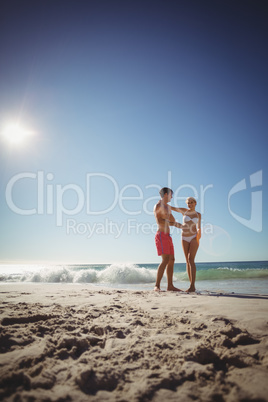 Couple dancing on beach