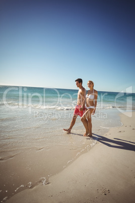 Couple walking on beach