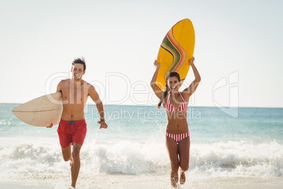 Couple running on beach