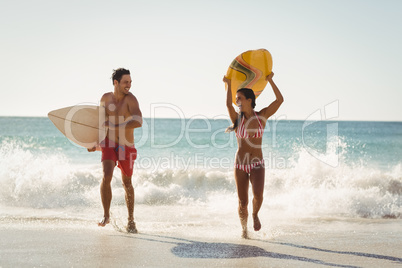 Couple running on beach