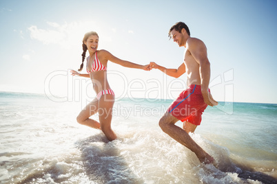 Couple playing in water