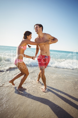 Couple playing in water