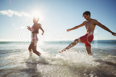 Couple playing in water