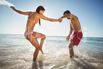 Couple playing in water