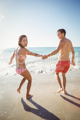 Excited couple on beach