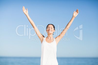 Woman standing with arms outstretched