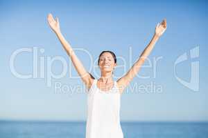 Woman standing with arms outstretched