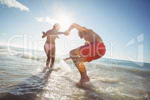 Couple playing in water