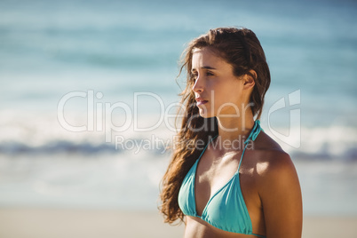 Thoughtful young woman on beach